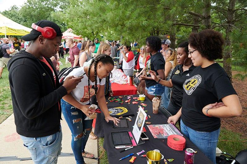 ABC students showing other students information during involvement fair